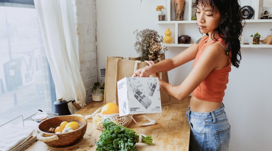a woman standing in front of a wooden table
